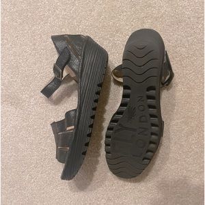 Black Fly London sandals with Velcro ankle strap.